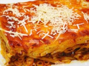 Pasticio A hearty, layered pasta casserole with spiced beef, cinnamon, and nutmeg, topped  with baked béchamel sauce.