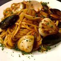 Clams Marechiaro Italian Clams sautéed with garlic, fresh basil, white wine, a touch of fresh tomato, and  breadcrumbs.