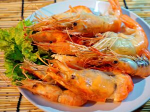 Spicy Shrimp Saganaki Ouzo-marinated shrimp with onions, garlic, tomatoes, and chilies, topped with  crumbled feta cheese and baked. Served with warm bruschetta.   $14.50