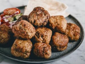 Greek Keftedes Meatballs Pan-fried meatballs made with spiced ground beef, served with marinara sauce on the side.