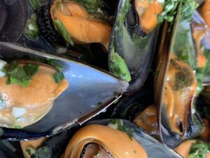 Mussels – Bianco Italian Black mussels sautéed in garlic and white wine, with your choice of white or  marinara sauce and breadcrumbs.