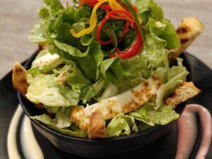 Greek Green Salad Chopped romaine, green onions, dill, feta cheese, and Yiannis vinaigrette.